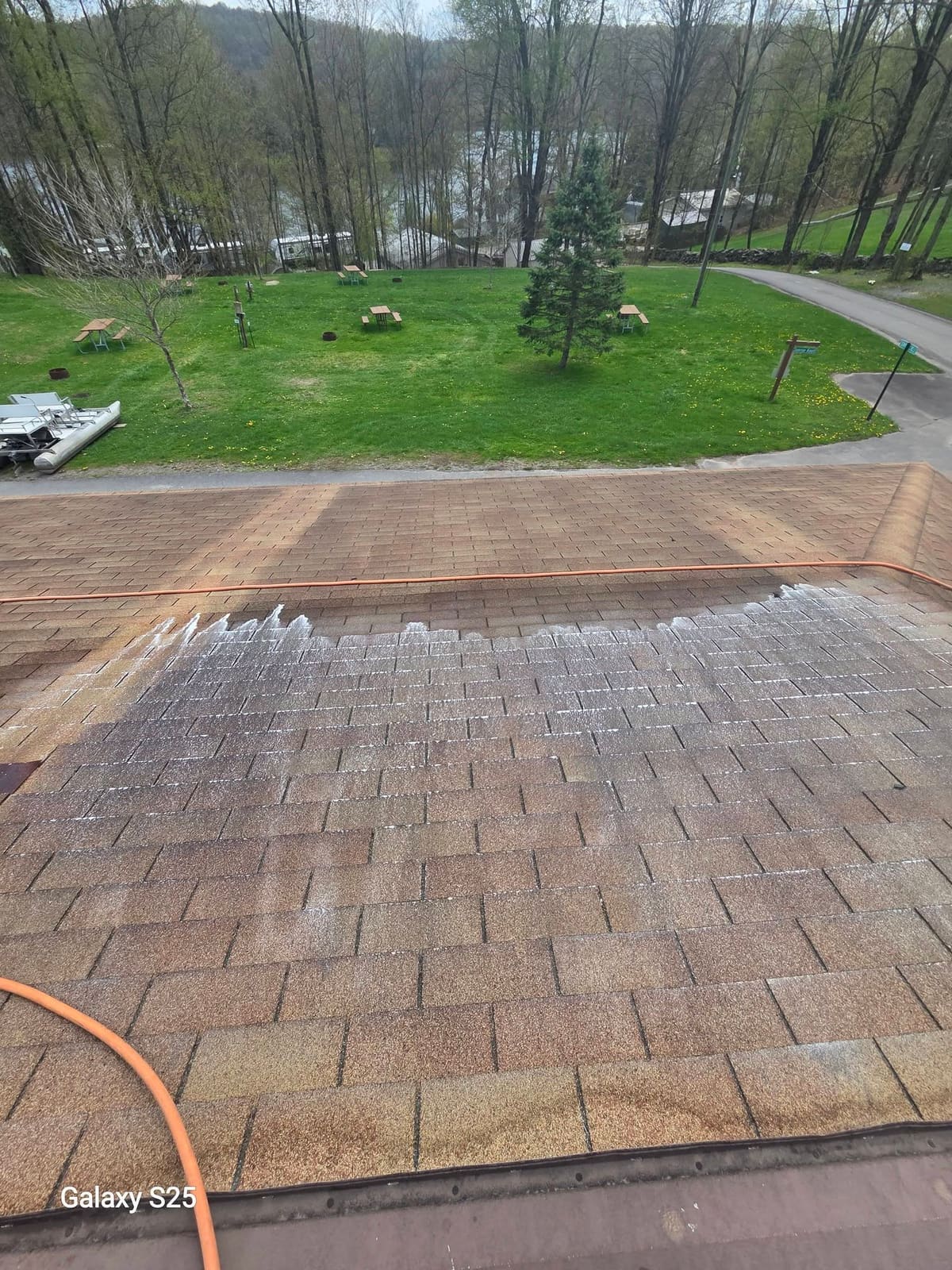 Paver patio half cleaned showing the difference between washed and unwashed brick